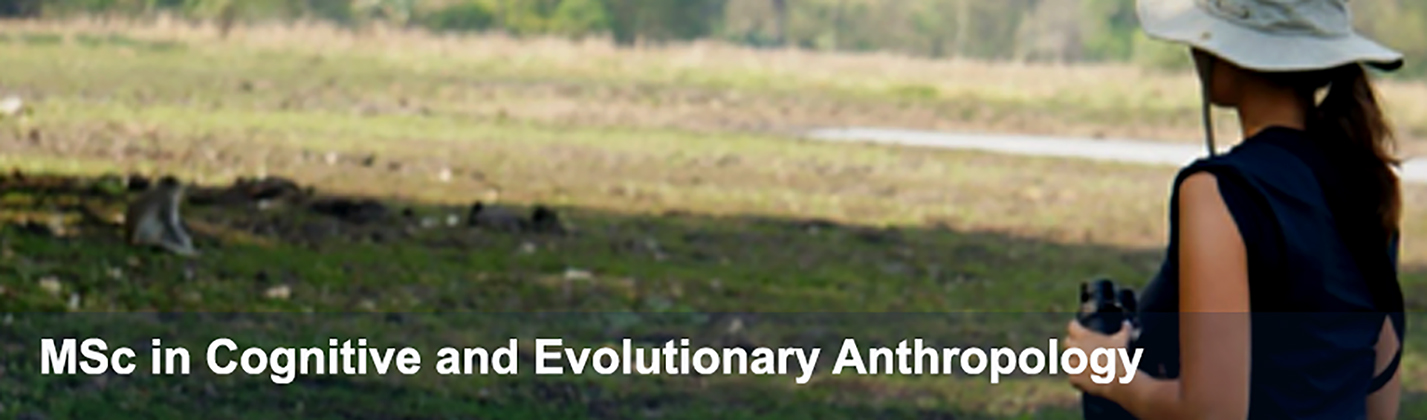 Photo of a female student observing baboons