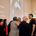 Representatives of Mākereti’s tribe share warm hugs after the Māori remembrance ceremony. 