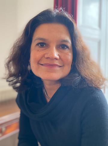 Alpa shah alpa shah is a south aisian woman wearing black sitting in an office