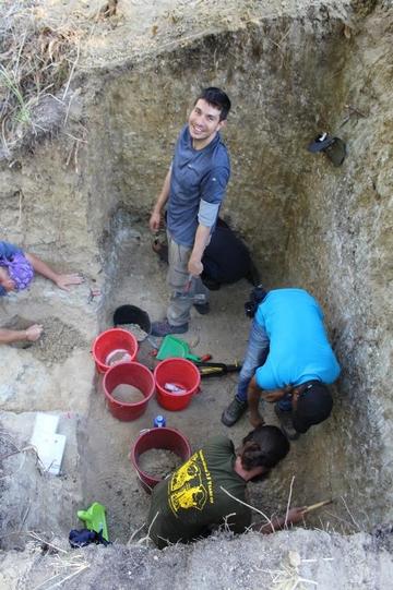 thomas puschel and joao coelho with students in the excavation pit