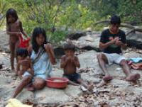 A Panará family enjoys a meal during a fishing trip, Brazil, 2007 (Photo by E. Ewart)