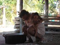 Panara woman with her granddaughter, preparing food, Brazil 2007 (Photo by E. Ewart)