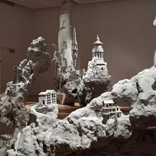 sculpture showing buildings and landscape in the gallery