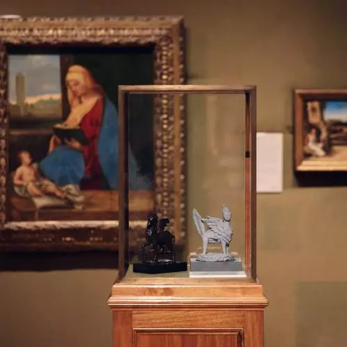 Small sculpture of winged animal in gallery of Renaissance art