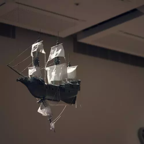 A model of a sailing ship suspended from the ceiling