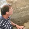 Ian Hodder inspects a section of Neolithic inscriptions in the walls at Catalhuyuk (Photo: Harvey Whitehouse)
