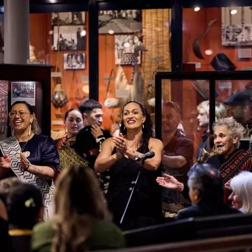Representatives of Mākereti's tribe, Tūhourangi, performing songs in the hall of the Pitt Rivers Museum.