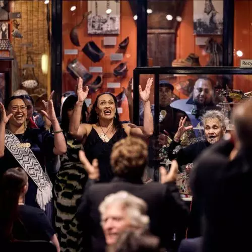 Representatives of Mākereti's tribe, Tūhourangi, performing songs and dances in the hall of the Pitt Rivers Museum.