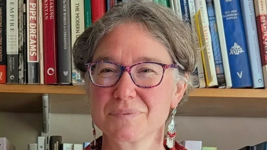 Madeleine Reeves in her office in front of a bookshelf