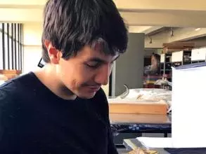 Dr Thomas A. Püschel in lab measuring bone