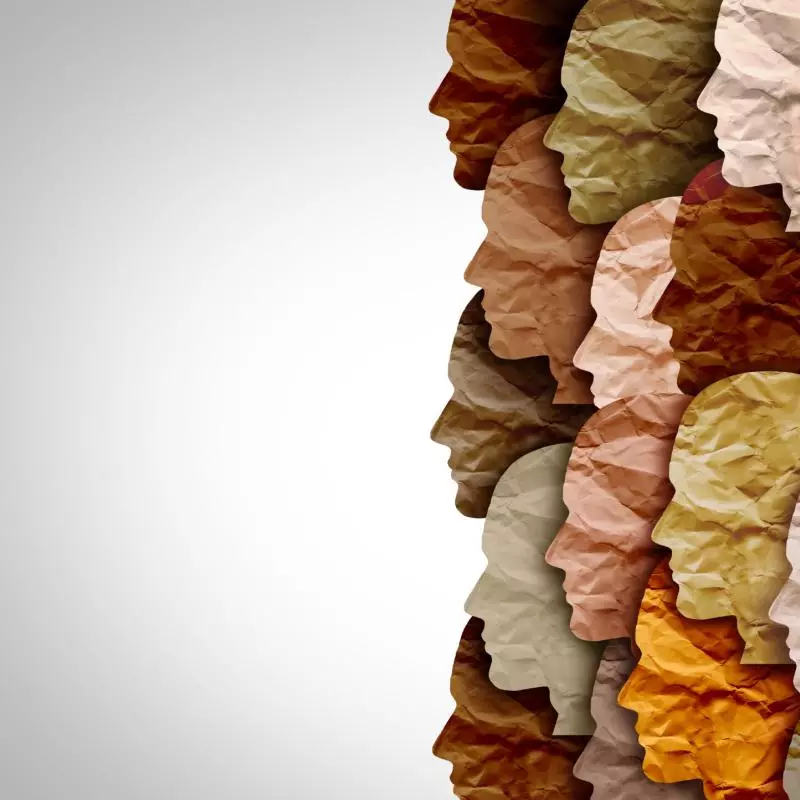 paper cutouts of heads in a mix of skin tones