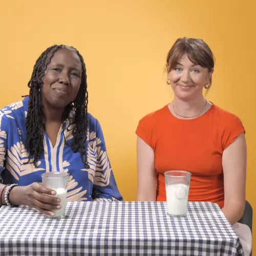 JC Niala and Johanna Zetterström-Sharp at a table with glasses of milk