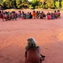 miller 3  a woman looks on as a meeting of the all male leadership council takes place escalvado brazil