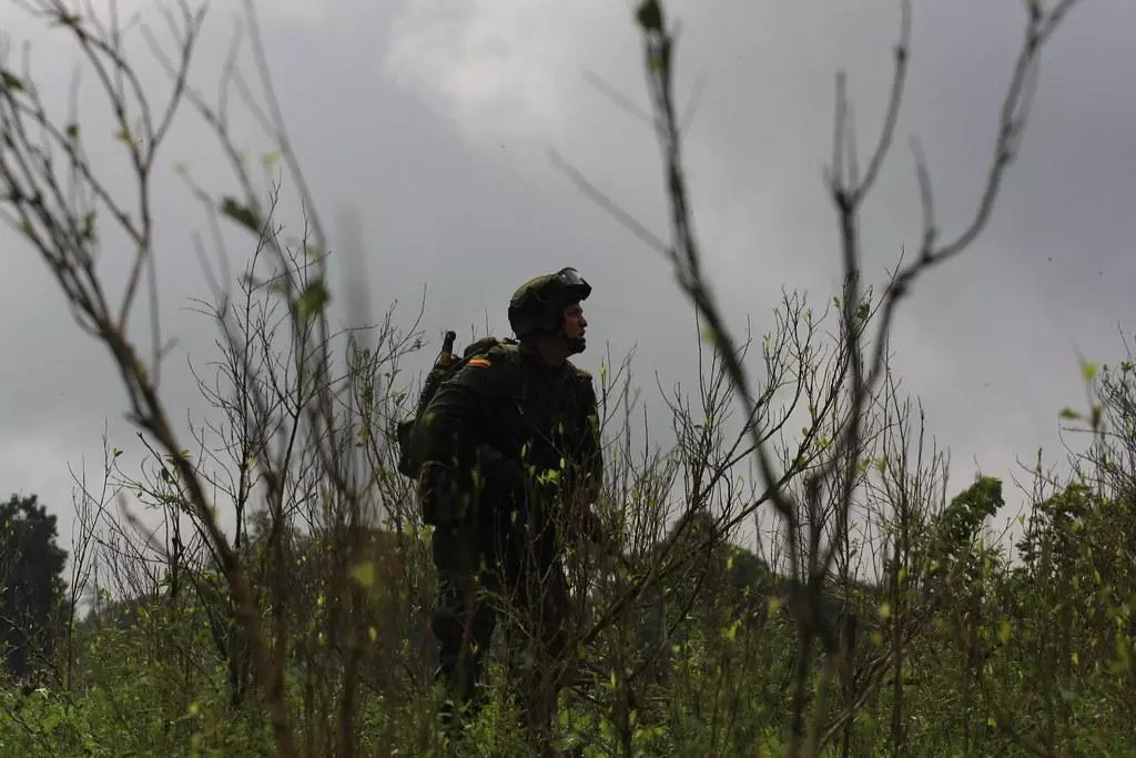 Anti-Narcotics Police in combat gear in a field
